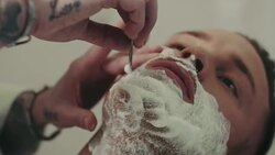 Barber shaving mans beard Stock Footage