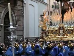 Golden Trono a religious float being carried by the Costaleros during Semana Santa, a procession through the streets of Malaga, Spain, Europe Stock Footage