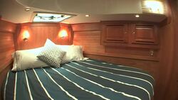 The forward cabin on Tartan Yacht holds a queen sized bed. Stock Footage