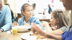 Family having lunch at a restaurant. Stock Footage