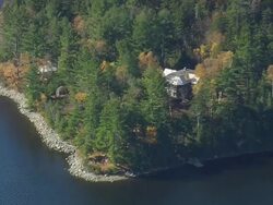 WS ARIEAL View of Forest house on bank of Flagstaff lake /Maine, United States Stock Footage