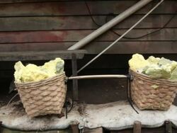 MS Miner basket full of solid sulfur / Ijen, Java, Indonesia Stock Footage