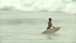 Surfers at Sao Conrado beach in Rio de Janeiro News Clip