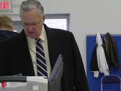 MS TU male voter casts ballot at copmuter terminal during voting in presidential election / Sylvania, Ohio, United States  Stock Footage