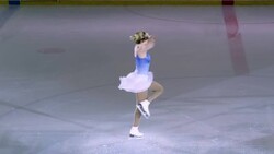 SLO MO Female figure skater ending performance with a spin Stock Footage