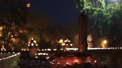 the light from the candle lit at night around wat maheyong Stock Footage