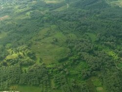 WS AERIAL View of town in valley near Kerkyra (Corfu city) with hill forest / Corfu, Ionian Islands, Greece Stock Footage