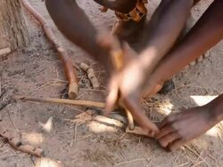 CU Shot of Damara tribe traditional life, Living Museum forming and hammering hot itron rods / Damaraland, Namibia, South Africa Stock Footage