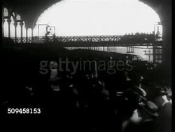 1936: LONDON, ENGLAND: Street scene w/ traffic, Double-decker bus moving up street FG, Houses of Parliament Clock Tower (Big Ben) BG. Instructional Video