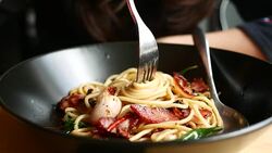 Woman eating spaghetti Stock Footage