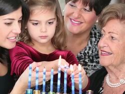 MS Four Generations of Jewish Women Lighting Hannukah Candles / Richmond, Virginia, USA Stock Footage