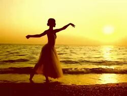 ballerina dancing on the beach Stock Footage