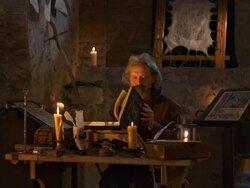HD: Monk Reading By Candlelight Stock Footage