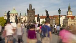 Crowds of pedestrians cross Charles Bridge. Stock Footage