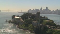 The waters of San Francisco Bay surround Alcatraz Island and prison. Stock Footage