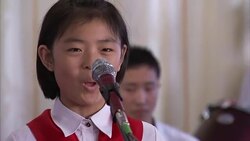 North Korean pupils performing songs at school News Clip