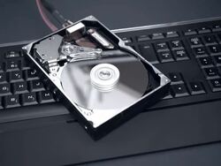 Spinning Hard Drive On Top Of Illuminated Keyboard Stock Footage