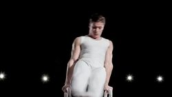 TU Gymnast performing double leg circle on pommel horse Stock Footage