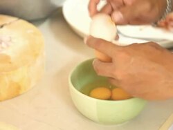 Cracking eggs Stock Footage