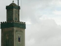MS View of sky moving over ornate mosque tower / Fez, Fes-Boulemane, Morocco Stock Footage