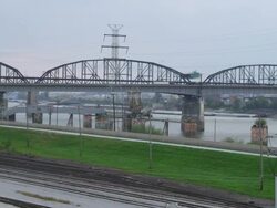 WS Shot of traffic moving on bridge over river with railway track / St. Louis, Missouri, United States Stock Footage