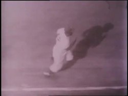 Baseball player Jackie Robinson hits the ball and runs around the bases. News Clip
