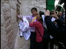 Pilgrims re-enact Christ''s final journey through Old City News Clip