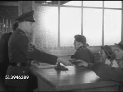 1953: TEMPELHOF AIRPORT: BERLIN, GERMANY: HA WS Airplanes at Berlin Tempelhof Airport. INT VS Various refugees & passengers waiting in terminal lobby, clerk checking passports & paperwork from line of refugees. South Berlin Instructional Video