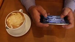 Businessman play game on mobile Stock Footage