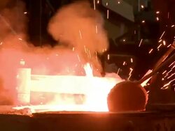 MS Smoke and sparks leaping in melting furnace / Langenfeld, North Rhine-Westphalia, Germany Stock Footage