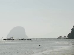 WS View of Long tail boats and Limestone rock in Sea , Marine National Park / Ko Hai, Krabi, Thailand Stock Footage