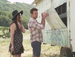 Young couple gathering eggs from hen house Stock Footage