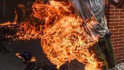 CLEAN : Venezuela: Demonstrator catches fires during violent clashes News Clip