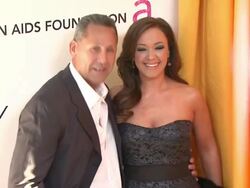 Angelo Pagan, Leah Remini at the 19th Annual Elton John AIDS Foundation Academy Awards Viewing Party at West Hollywood CA. (Footage by WireImage Video/GettyImages) Stock Footage