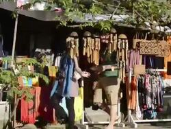 MS Tourists Passing souvenir shops at Jalan Hanoman shopping street / Ubud, Bali, Indonesia Stock Footage
