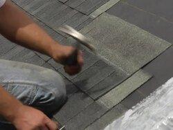 CU  SLO MO Shot of workers arms and hands as he hammers / Chelsea, Michigan, United States Stock Footage