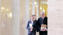 Judge and lawyers walking in courthouse Stock Footage