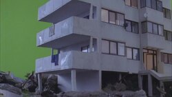 The corner of a building collapses in a flood-water simulation. Stock Footage