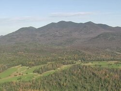 WS AERIAL Pan ZI Shot of play ground with Old Olymic Flame structure at airport near Placid lake / New York, United States Stock Footage