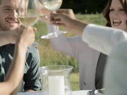 People toasting wine glasses at outdoor dinner party Stock Footage