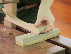 hands of a carpenter planing a plank of wood Stock Footage