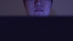 man working using computer at night Stock Footage