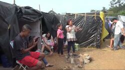 Thousands occupy land near stadium that will host opening match in football World Cup Instructional Video