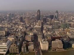 Aerial wide shot traffic on London Bridge in the financial district / London, England Stock Footage