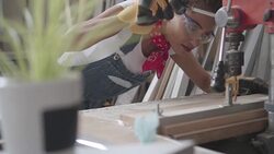 Latina Carpenter Drilling Plank In Her Workshop Stock Footage
