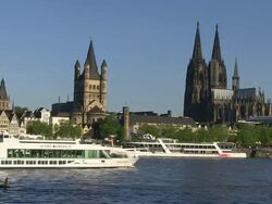 WS Boat at Rhine river, Cathedral and church / Cologne, North Rhine Westphalia, Germany Stock Footage