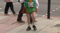 Protester dancing Irish Jig outside court News Clip