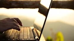 HD:Young woman typing on laptop keyboard Stock Footage