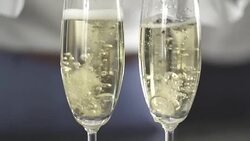 HD Super Slow-Mo: Ring Dropping In Champagne Stock Footage
