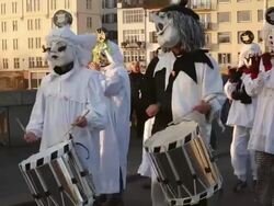 MS TS Shot of people with mask and dressing up celebrating Basler Fasnacht (Basel Carnival) on street / Basel, Switzerland Stock Footage